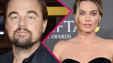 Leonardo DiCaprio und Margot Robbie gucken ernst 