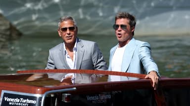 George Clooney und Brad Pitt auf einem Boot