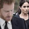 Prinz Harry guckt traurig, Herzogin Meghan guckt ernst