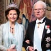 Königin Silvia hakt sich lächelnd bei König Carl Gustaf unter