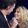 Florian Silbereisen und Helene Fischer lächeln sich an