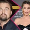 Leonardo DiCaprio und Margot Robbie gucken ernst 