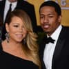 Mariah Carey und Nick Cannon gucken nicht glücklich in Abendkleidung.