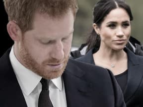 Prinz Harry guckt traurig, Herzogin Meghan guckt ernst