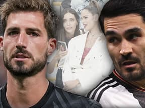 WM 2022 in Katar: Kevin Trapp und Ilkay Gündogan - im Hintergrund die Spielerfrauen Sara Gündogan und Izabel Goulart in Katar auf der Tribüne