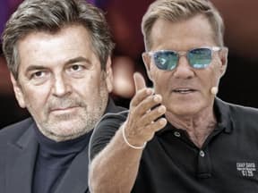 Fotomontage Thomas Anders traurig und Dieter Bohlen ernst mit Hand oben