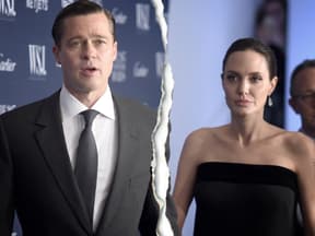 Brad Pitt und Angelina Jolie gehen nebeneinander, in der Mitte ein Riss