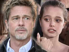 Brad Pitt und Shiloh Jolie-Pitt blicken besorgt zur Seite