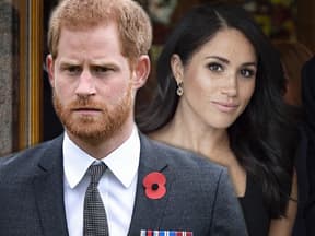 Prinz Harry sieht ernst aus, Herzogin Meghan lächelt im Hintergrund