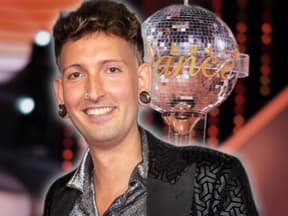 Fabian Kahl lächelt, im Hintergrund steht der "Let's Dance"-Pokal