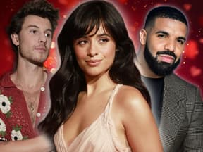 Camilla Cabelo strahlt, im Hintergrund steht Shawn Mendes mit verschränkten Armen und ein schmunzelnder Drake