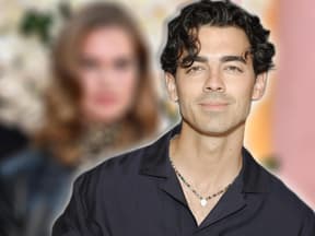 Joe Jonas lächelt, im Hintergrund ein verschwommenes Bild von Storm Bree