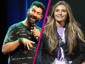 Faisal Kawusi zieht eine Grimasse, Sophia Thomalla lächelt glücklich