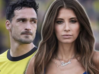 Cathy Hummels guckt ernst in die Kamera, hinter ihr steht Mats Hummels mit traurigem Blick