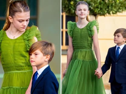 Prinzessin Estelle hält ihren Bruder Prinz Oskar an der Hand