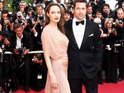 Lächeln die Krisen-Gerüchte einfach weg: Angelina Jolie und Brad Pitt bei den Filmfestspielen in Cannes