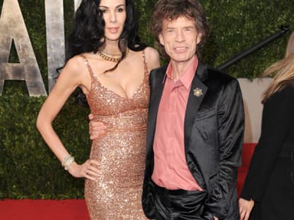 Designerin L'Wren Scott und Mick Jagger stellen sich für ein Foto auf