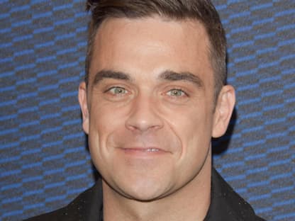 Robbie Williams machte zum Ende seiner Europa-Tour mit "Take That" in München Halt und begeisterte das Publikum der "Cars 2"-Premiere